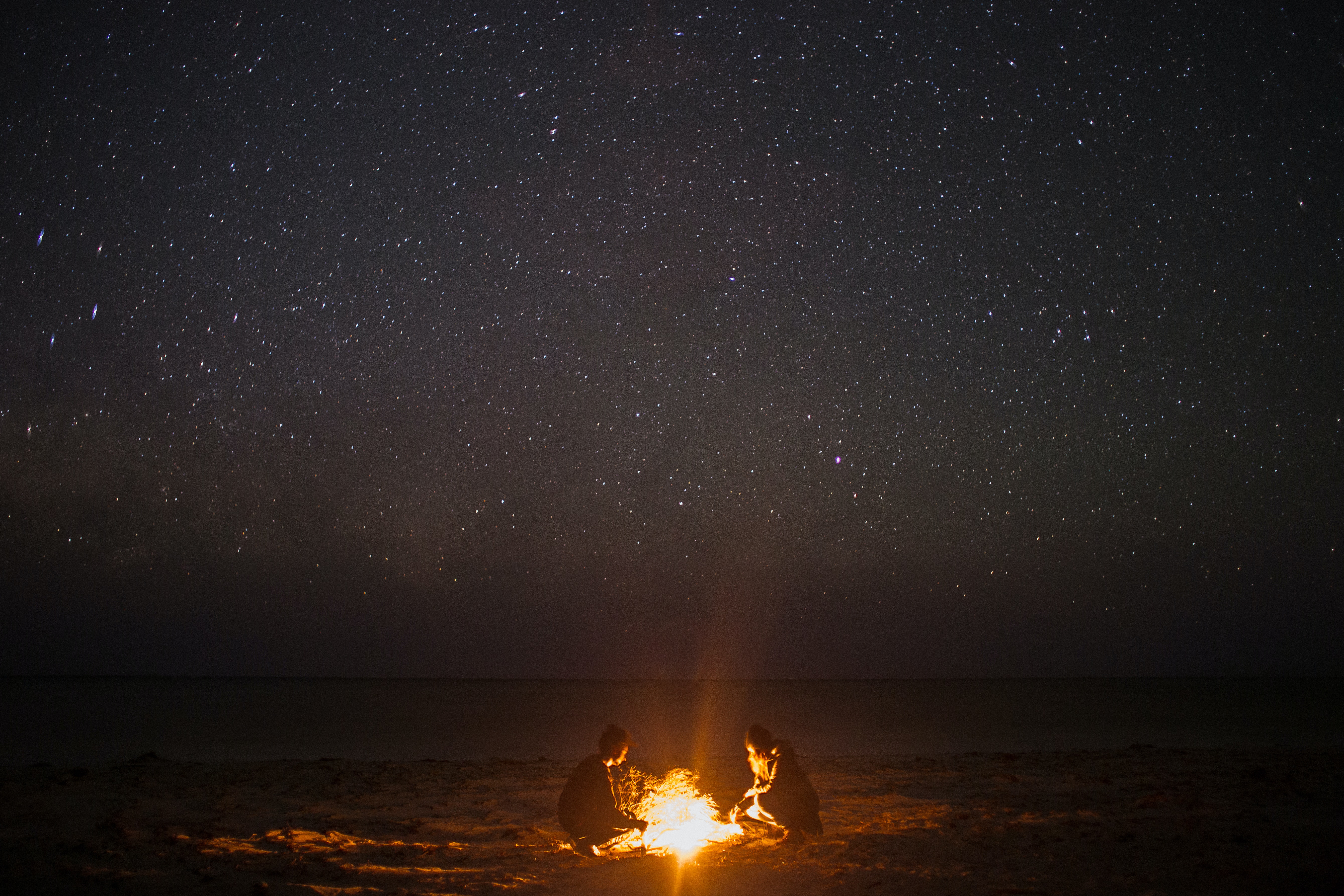 Photo by Rachel Claire: https://www.pexels.com/photo/unrecognizable-couple-near-bonfire-on-coast-at-night-sky-5531009/