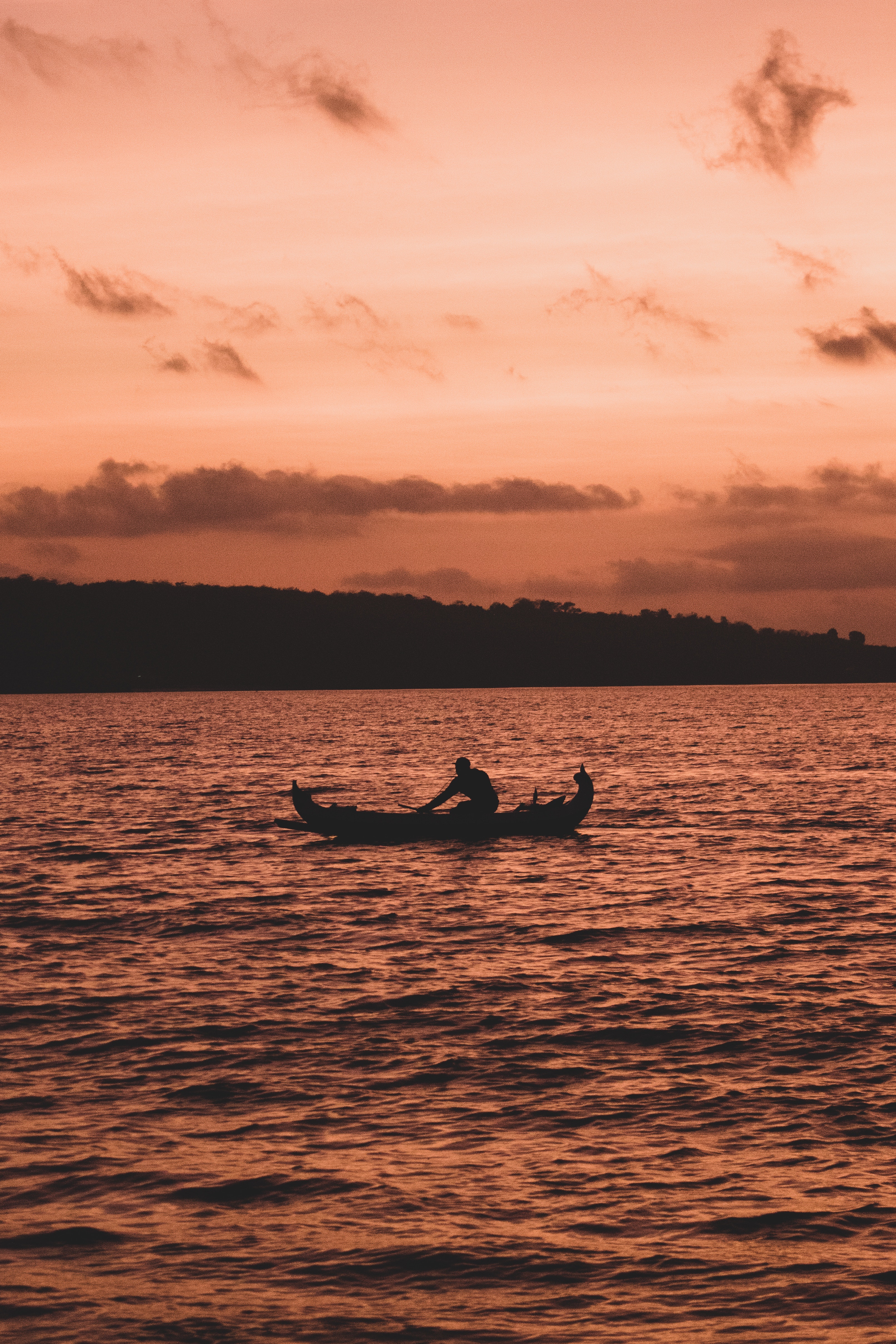 Photo by Stephane Hurbe: https://www.pexels.com/photo/silhouette-of-person-riding-on-boat-during-sunset-4083999/